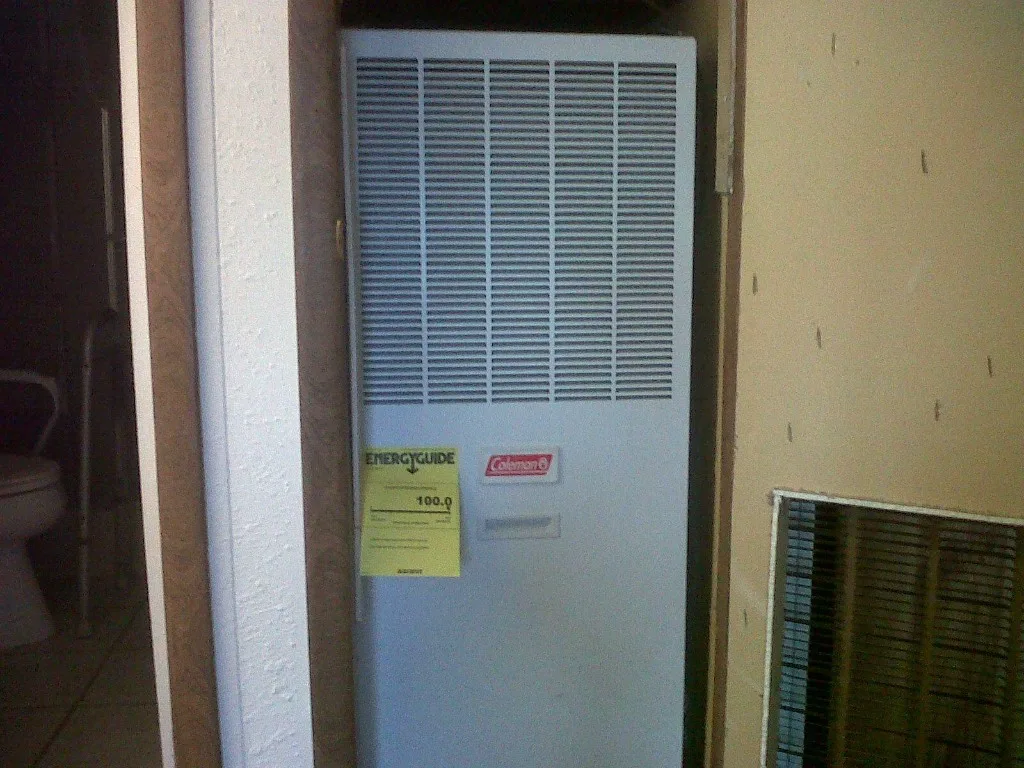 Coleman mobile-home furnace with EnergyGuide sticker installed by Unlimited