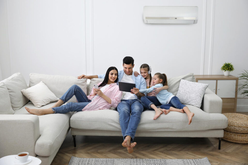 family in the living room with ac system